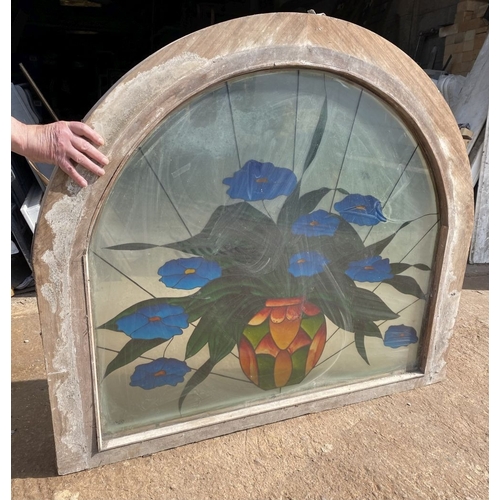 130 - A BEAUTIFUL ARCHED STAINED GLASS WINDOW, c.1993, with blue flowers in vase in vibrant colours, signe... 