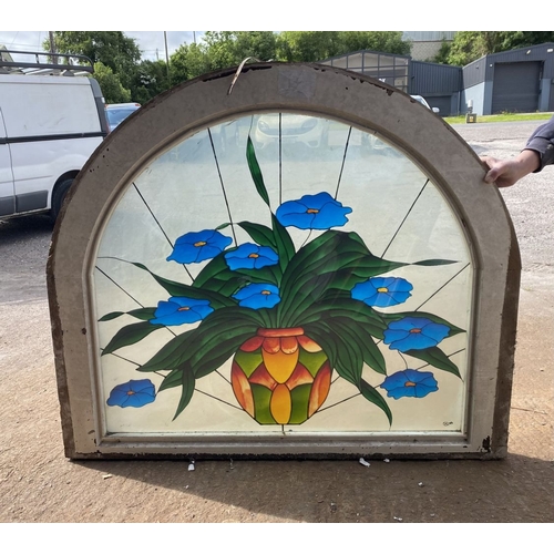 130 - A BEAUTIFUL ARCHED STAINED GLASS WINDOW, c.1993, with blue flowers in vase in vibrant colours, signe... 