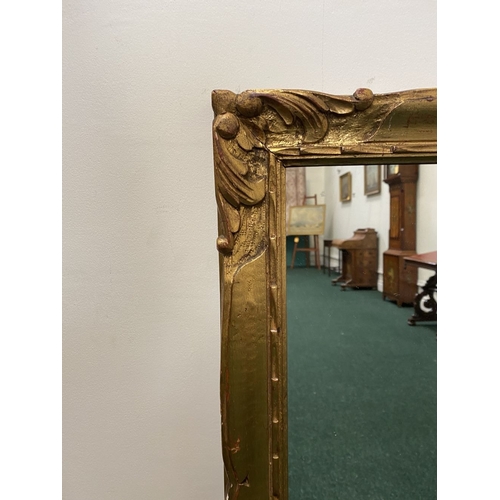 141 - A 19TH CENTURY GILTWOOD HALL MIRROR, of rectangular form, with French style moulded scroll decoratio... 