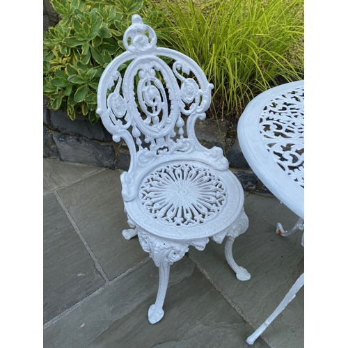 15 - A PAIR OF DECORATIVE CAST IRON GARDEN CHAIRS AND CIRCULAR TABLE, Coalbrookdale style cast iron garde... 