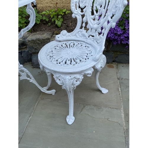 15 - A PAIR OF DECORATIVE CAST IRON GARDEN CHAIRS AND CIRCULAR TABLE, Coalbrookdale style cast iron garde... 