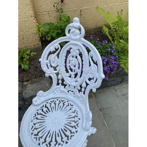 15 - A PAIR OF DECORATIVE CAST IRON GARDEN CHAIRS AND CIRCULAR TABLE, Coalbrookdale style cast iron garde... 