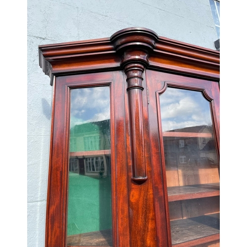 17 - A STUNNING QUALITY IRISH FLAME MAHOGANY SERPENTINE SHAPED BOOKCASE, after Robert Strahan Dublin. Wit... 