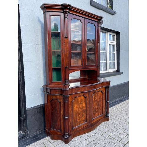 17 - A STUNNING QUALITY IRISH FLAME MAHOGANY SERPENTINE SHAPED BOOKCASE, after Robert Strahan Dublin. Wit... 