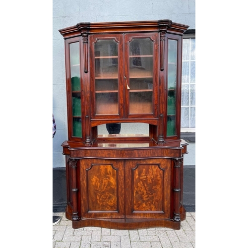 17 - A STUNNING QUALITY IRISH FLAME MAHOGANY SERPENTINE SHAPED BOOKCASE, after Robert Strahan Dublin. Wit... 