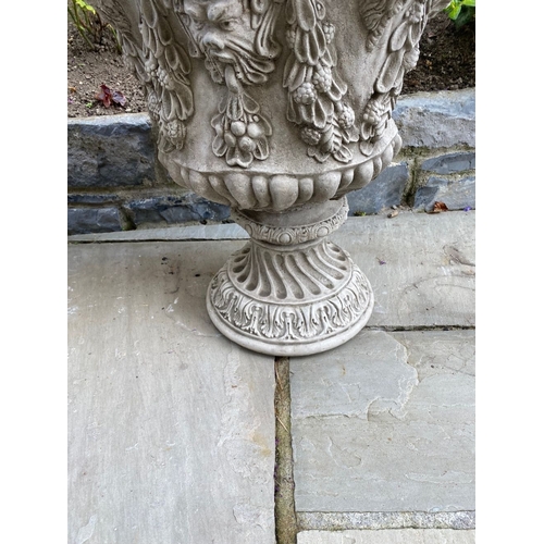 24 - A LARGE PAIR OF STONE BACCHUS DESIGN GARDEN URNS, highly decorated throughout, dimensions: 52cm diam... 