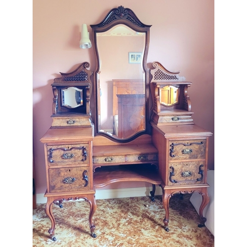 37 - AN EARLY 20TH CENTURY MIRRORED DRESSING UNIT WITH CENTRAL LONG MIRROR. Some carved moulding pieces a... 