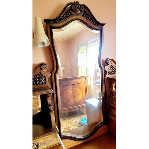 37 - AN EARLY 20TH CENTURY MIRRORED DRESSING UNIT WITH CENTRAL LONG MIRROR. Some carved moulding pieces a... 