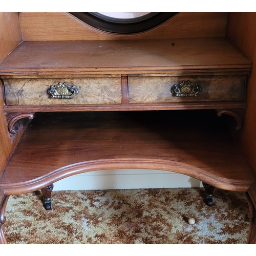 37 - AN EARLY 20TH CENTURY MIRRORED DRESSING UNIT WITH CENTRAL LONG MIRROR. Some carved moulding pieces a... 