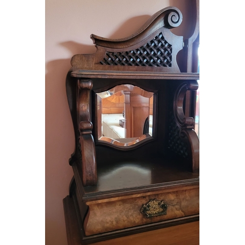 37 - AN EARLY 20TH CENTURY MIRRORED DRESSING UNIT WITH CENTRAL LONG MIRROR. Some carved moulding pieces a... 