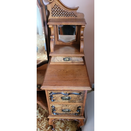 37 - AN EARLY 20TH CENTURY MIRRORED DRESSING UNIT WITH CENTRAL LONG MIRROR. Some carved moulding pieces a... 