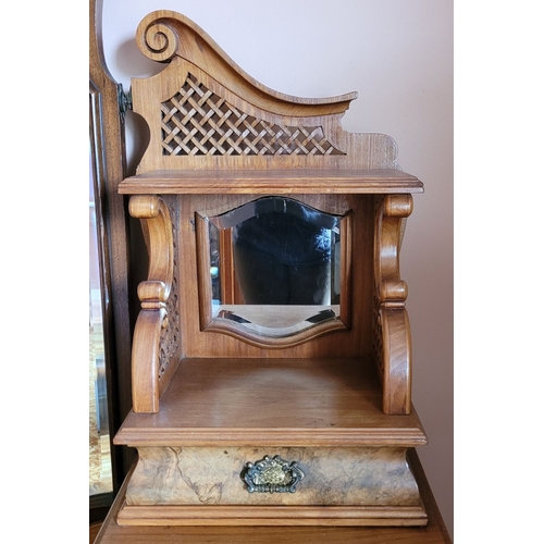 37 - AN EARLY 20TH CENTURY MIRRORED DRESSING UNIT WITH CENTRAL LONG MIRROR. Some carved moulding pieces a... 