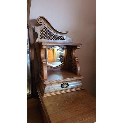 37 - AN EARLY 20TH CENTURY MIRRORED DRESSING UNIT WITH CENTRAL LONG MIRROR. Some carved moulding pieces a... 