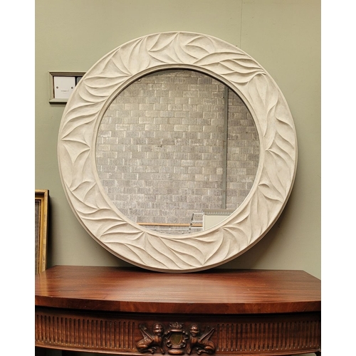 62 - A VERY GOOD PORTA ROMANA WHITE COLOURED CIRCULAR WALL MIRROR, with wave type design to the frame. In... 