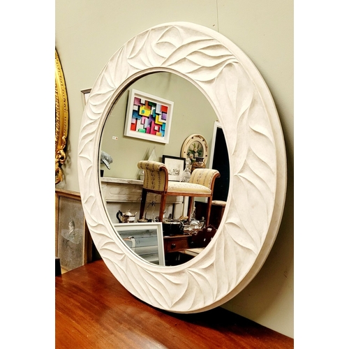 62 - A VERY GOOD PORTA ROMANA WHITE COLOURED CIRCULAR WALL MIRROR, with wave type design to the frame. In... 