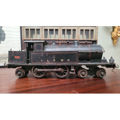 64 - TWO ANTIQUE TOY TRAIN / MODEL TRAIN PIECES: (i) A CLOCKWORK LOCOMOTIVE –maker not confirmed – possib... 