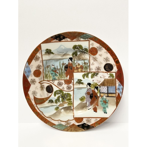 69 - A PAIR OF JAPANESE KUTANI PORCELAIN PAINTED PLATES, each featuring hand-painted picture panels depic... 