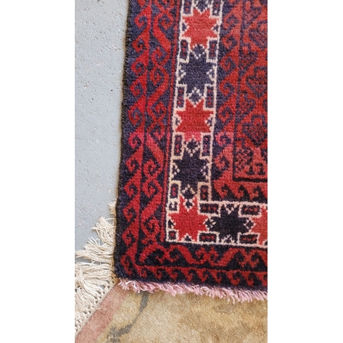 77 - A NICELY WOVEN FLOOR RUG BOKHARA STYLE, with main ground colour red, a repeat pattern to the centre ... 