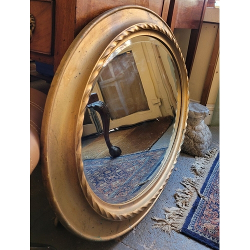 80 - A VERY GOOD QUALITY OVAL GILT WALL MIRROR – lovely ripple to the old mirror pane, with bevelled edge... 