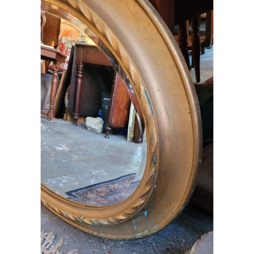 80 - A VERY GOOD QUALITY OVAL GILT WALL MIRROR – lovely ripple to the old mirror pane, with bevelled edge... 