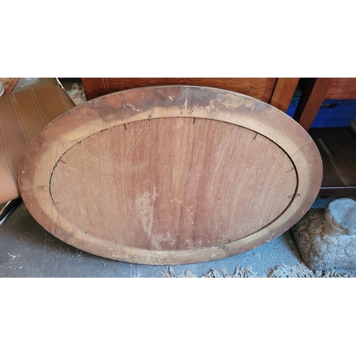 80 - A VERY GOOD QUALITY OVAL GILT WALL MIRROR – lovely ripple to the old mirror pane, with bevelled edge... 