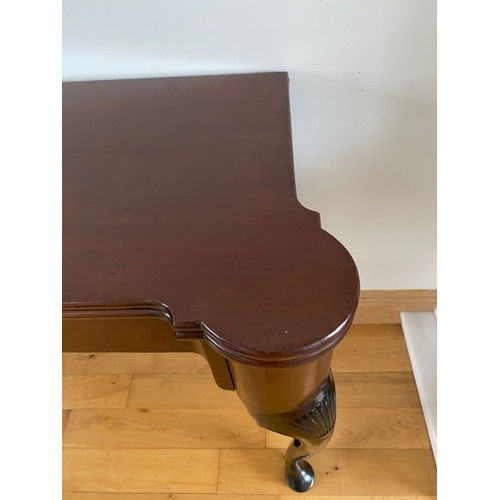 83 - AN IRISH MAHOGANY CARD TABLE, top with porringer corners, above frieze with shell motif to centre. S... 