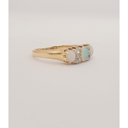 107 - A VERY GOOD QUALITY VICTORIAN ERA 18CT YELLOW GOLD OPAL & DIAMOND RING, with four round cut diamonds... 