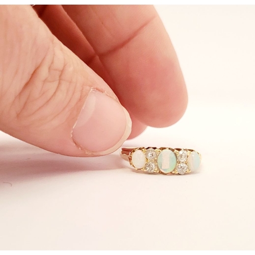 107 - A VERY GOOD QUALITY VICTORIAN ERA 18CT YELLOW GOLD OPAL & DIAMOND RING, with four round cut diamonds... 