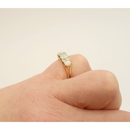 107 - A VERY GOOD QUALITY VICTORIAN ERA 18CT YELLOW GOLD OPAL & DIAMOND RING, with four round cut diamonds... 