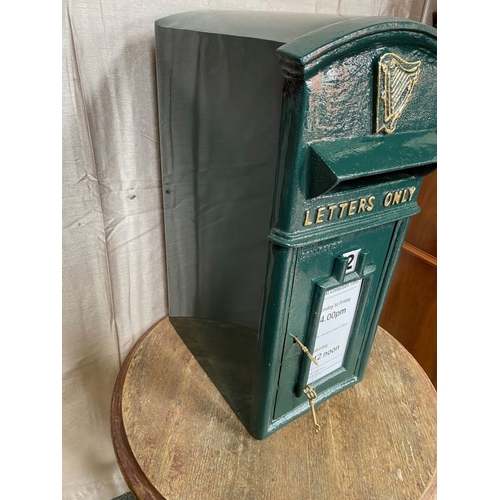 110 - A CAST IRON IRISH POST BOX, traditional form, with arched top above gilt harp, reading ‘letters only... 