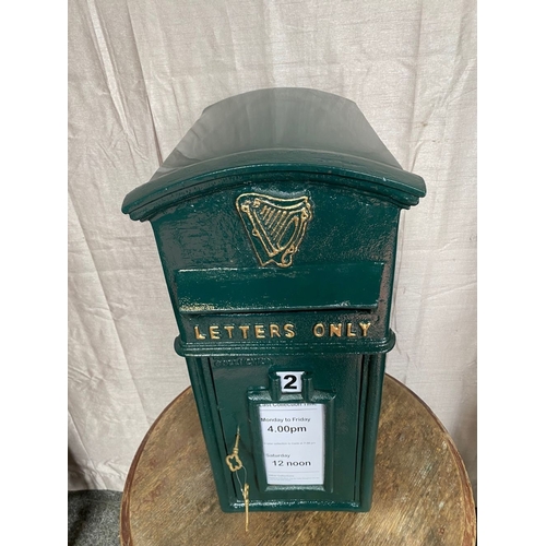 110 - A CAST IRON IRISH POST BOX, traditional form, with arched top above gilt harp, reading ‘letters only... 