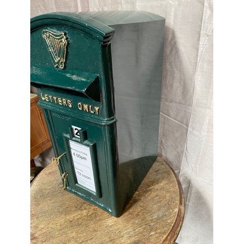 110 - A CAST IRON IRISH POST BOX, traditional form, with arched top above gilt harp, reading ‘letters only... 