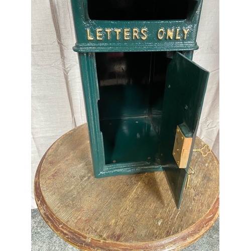 110 - A CAST IRON IRISH POST BOX, traditional form, with arched top above gilt harp, reading ‘letters only... 