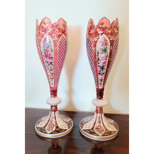 33 - A BEAUTIFUL PAIR OF MID-19TH CENTURY BOHEMIAN RUBY & WHITE OVERLAY VASES each of tulip form with a s... 