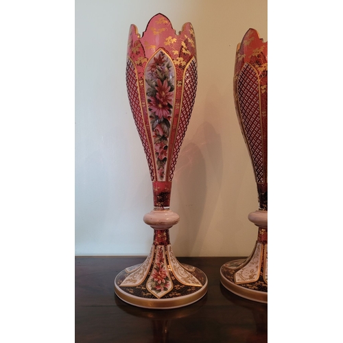 33 - A BEAUTIFUL PAIR OF MID-19TH CENTURY BOHEMIAN RUBY & WHITE OVERLAY VASES each of tulip form with a s... 