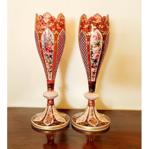 33 - A BEAUTIFUL PAIR OF MID-19TH CENTURY BOHEMIAN RUBY & WHITE OVERLAY VASES each of tulip form with a s... 