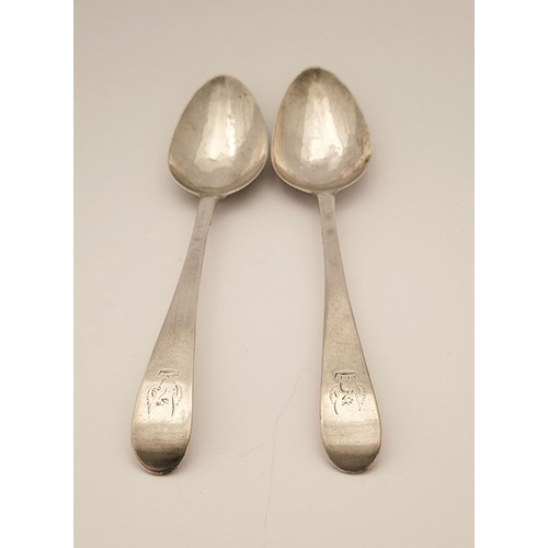 46 - A PAIR OF IRISH GEORGE III SILVER SERVLING SPOONS, engraved to the tips with an eagle over crown cre... 