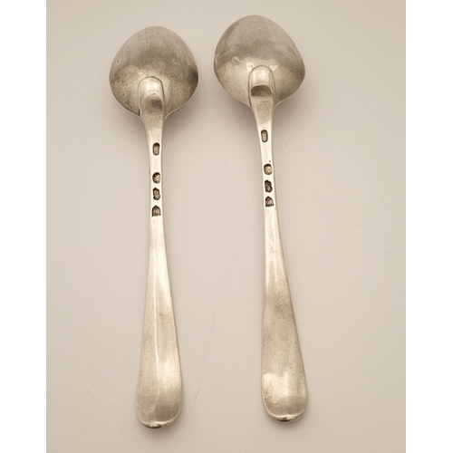 46 - A PAIR OF IRISH GEORGE III SILVER SERVLING SPOONS, engraved to the tips with an eagle over crown cre... 