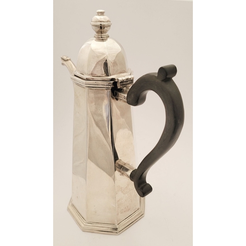 49 - AN IRISH LATE 20TH CENTURY SILVER COFFEE POT, of octagonal shape, with a finial top to the hinged li... 