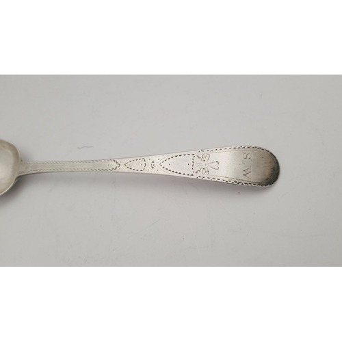 66 - A LATE 18TH CENTURY GEORGIAN BRIGHTCUT DECORATED SILVER SPOON BY GEORGE GRAY, the stem decorated all... 