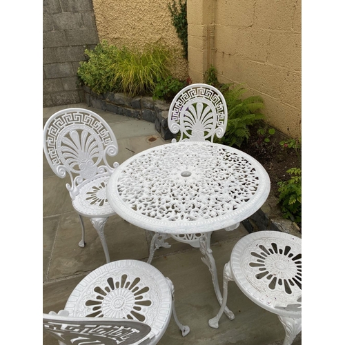 68 - A DECORATIVE CAST ALLOY GARDEN FURNITURE SUITE, to include four chairs and table. The garden chairs ... 