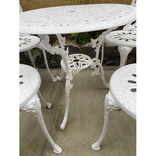 68 - A DECORATIVE CAST ALLOY GARDEN FURNITURE SUITE, to include four chairs and table. The garden chairs ... 