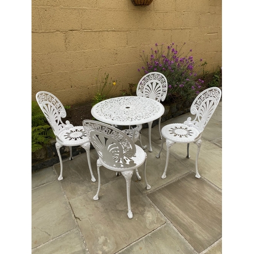 68 - A DECORATIVE CAST ALLOY GARDEN FURNITURE SUITE, to include four chairs and table. The garden chairs ... 