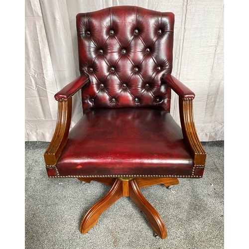 8 - A CHESTERFIELD STYLE OX-BLOOD LEATHER BUTTON BACKED ADJUSTABLE OFFICE / LIBRARY CHAIR, the camel sha... 