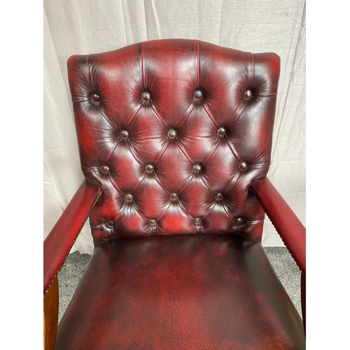 8 - A CHESTERFIELD STYLE OX-BLOOD LEATHER BUTTON BACKED ADJUSTABLE OFFICE / LIBRARY CHAIR, the camel sha... 