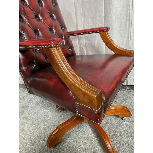 8 - A CHESTERFIELD STYLE OX-BLOOD LEATHER BUTTON BACKED ADJUSTABLE OFFICE / LIBRARY CHAIR, the camel sha... 