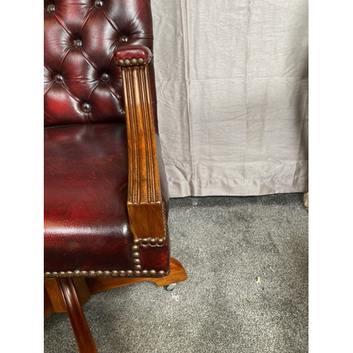 8 - A CHESTERFIELD STYLE OX-BLOOD LEATHER BUTTON BACKED ADJUSTABLE OFFICE / LIBRARY CHAIR, the camel sha... 