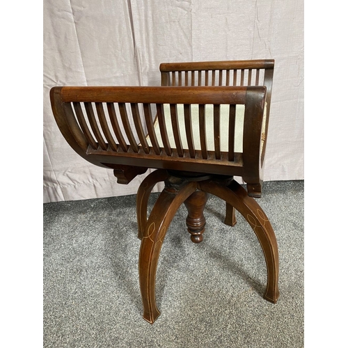 89 - AN EARLY 20TH CENTURY CURVED ADJUSTABLE PIANO / DRESSING STOOL, the seat is curved with upright bars... 