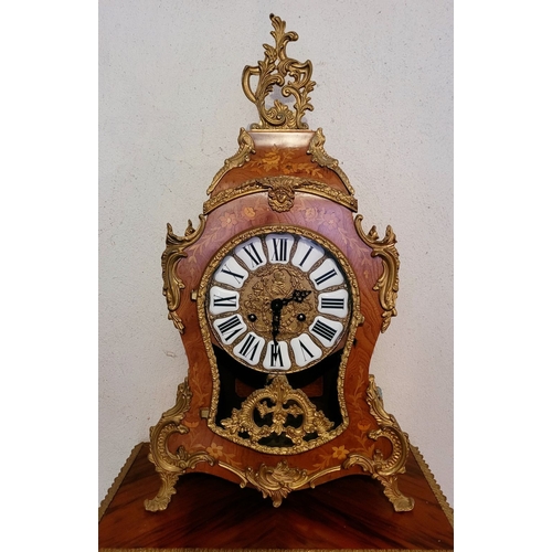 9 - A VINTAGE GERMAN FRANZ HERMLE ROCOCO STYLE MANTLE CLOCK, the shaped clock decorated with brass ormol... 