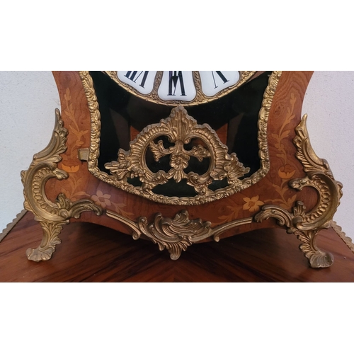 9 - A VINTAGE GERMAN FRANZ HERMLE ROCOCO STYLE MANTLE CLOCK, the shaped clock decorated with brass ormol... 